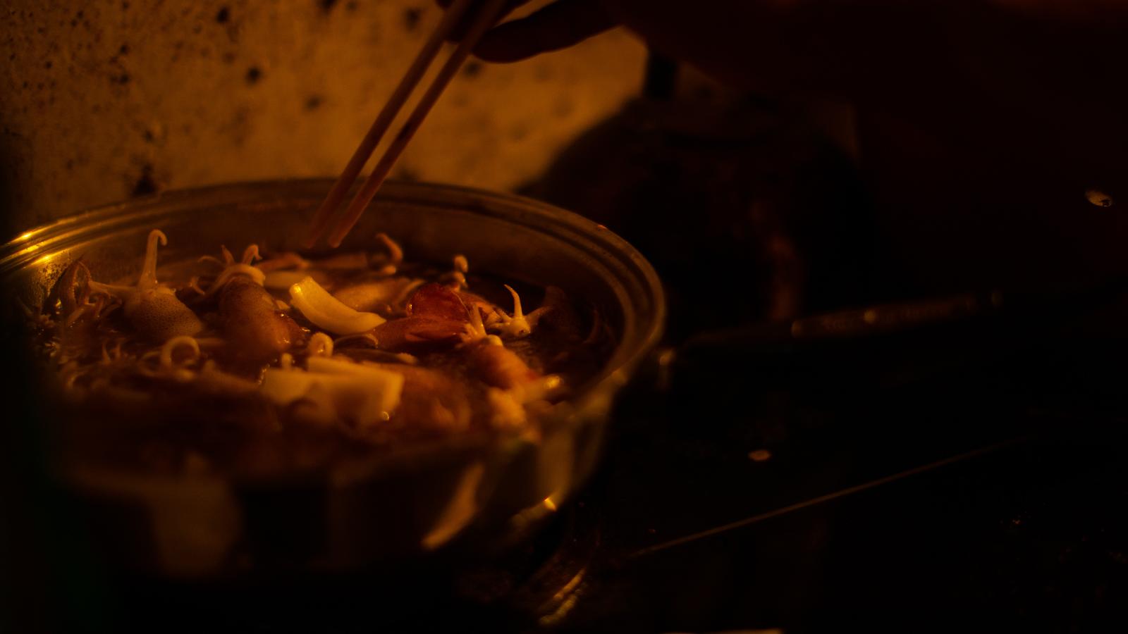 A closeup of a dish that the deck hand is cooking.