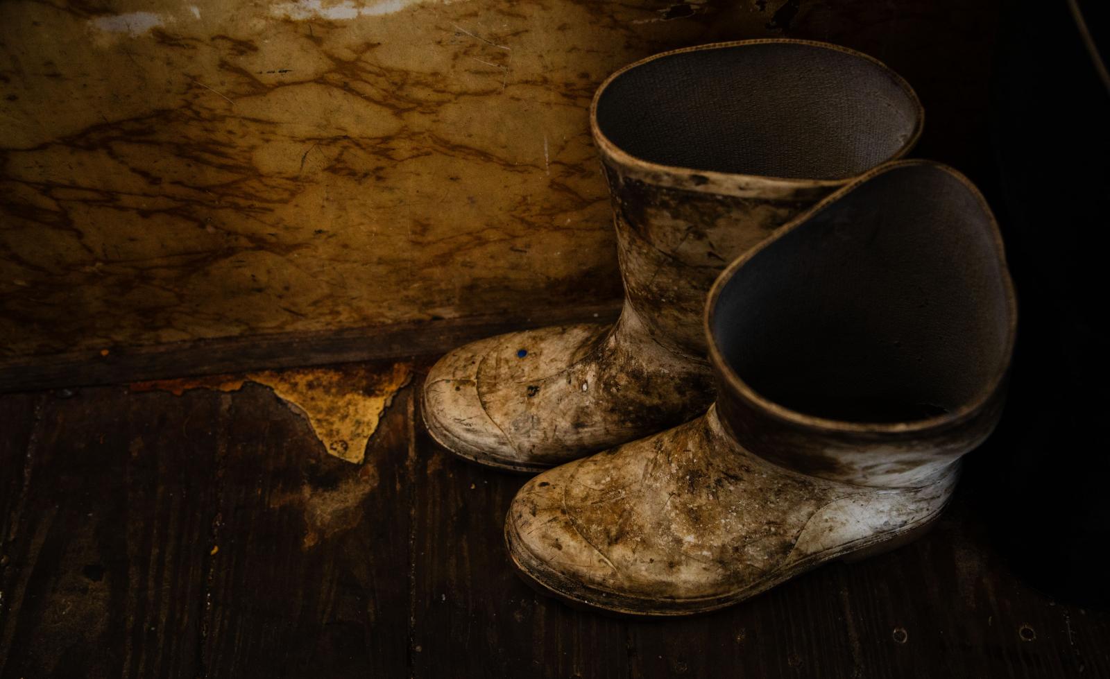 Dirty boots on a vietnamese fishing boats.